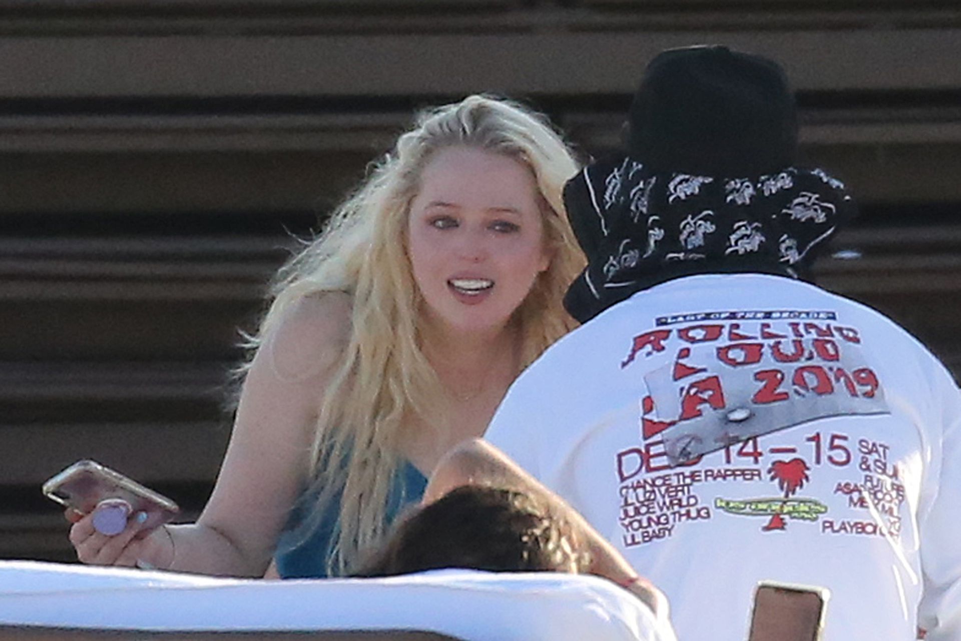 Tiffany Trump wears a blue swimsuit and appears to go through a range of em...