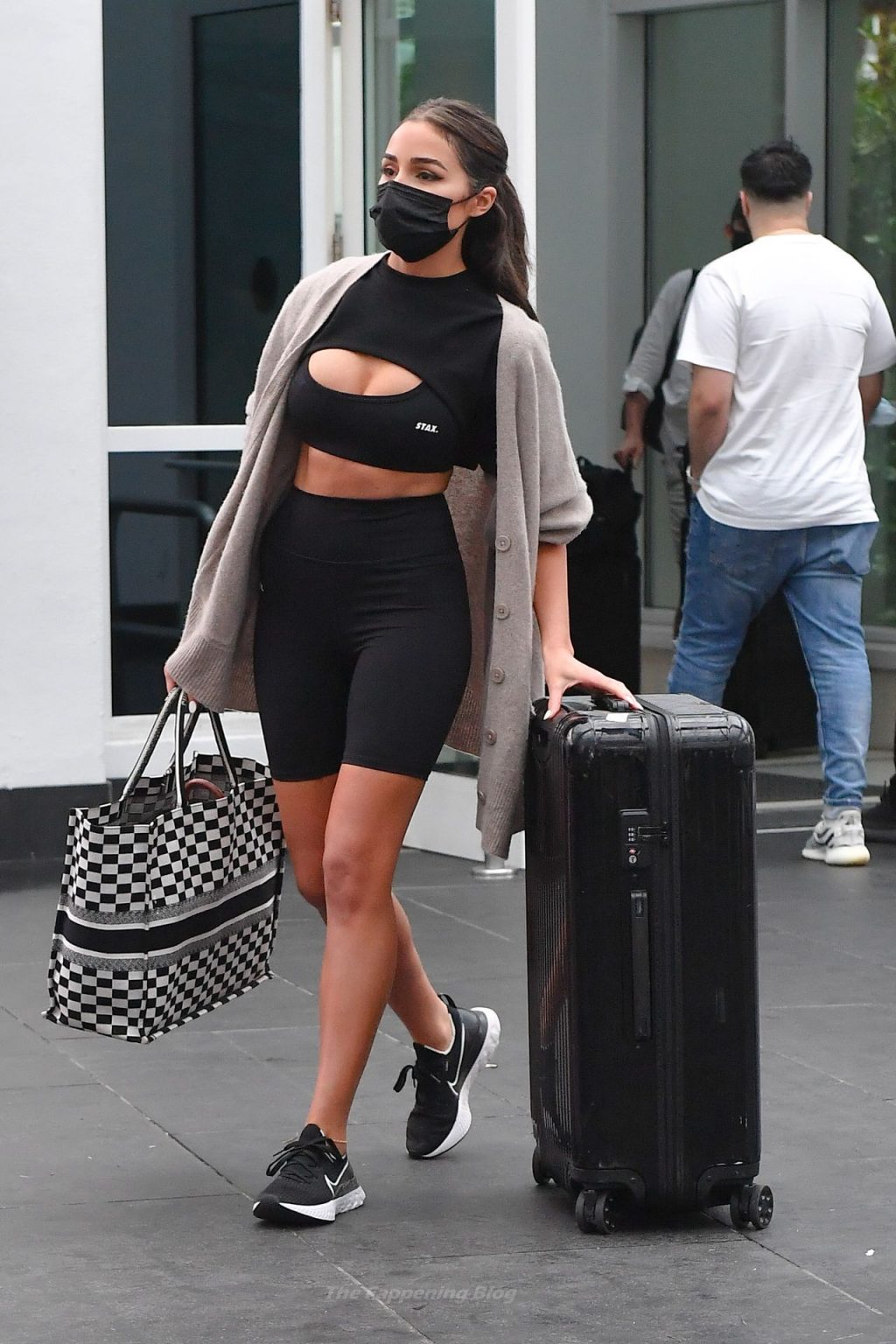 Olivia Culpo is Stylish in Athletic Gear as She Rolls Her Luggage in Miami (7 Photos)