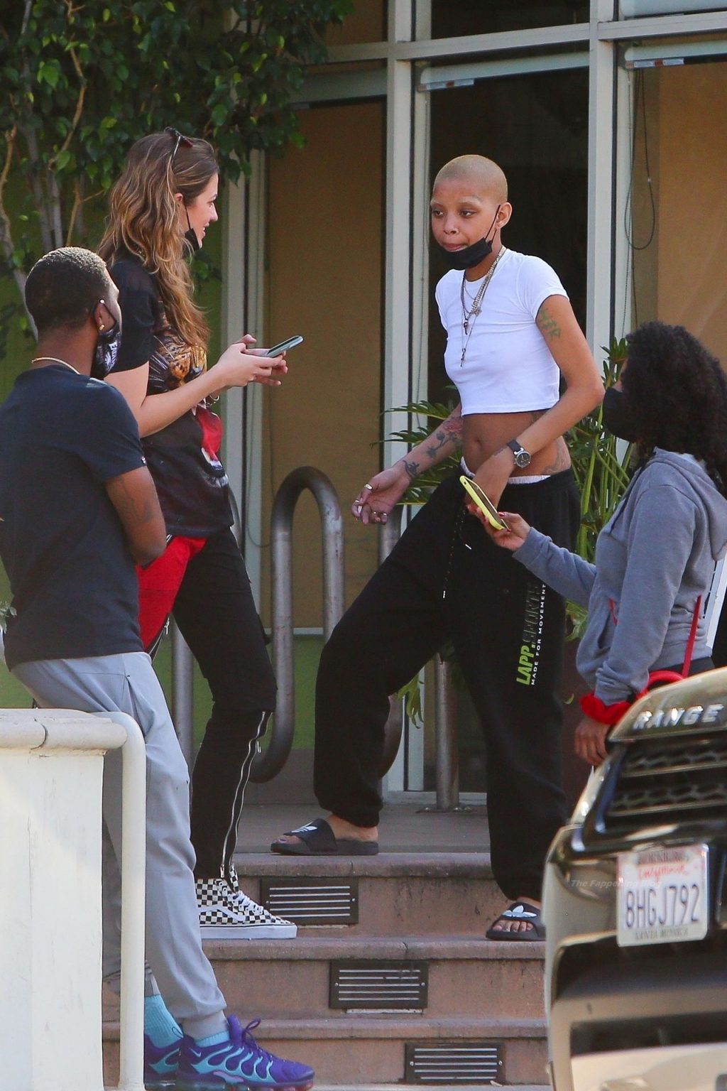 Braless Slick Woods is Pictured Socializing with Friends (22 Photos)