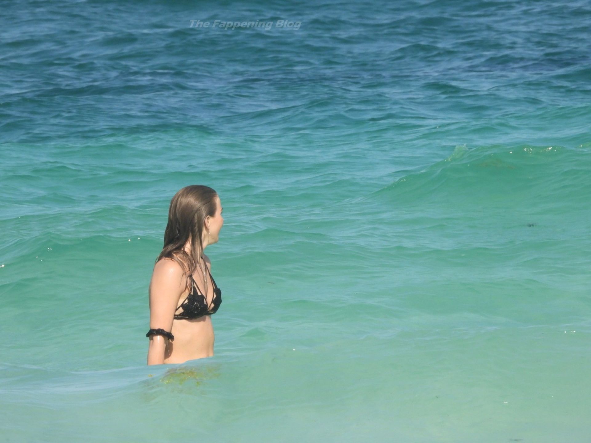 Julianne Hough soaks up the sun in a black bikini while enjoying a holiday ...