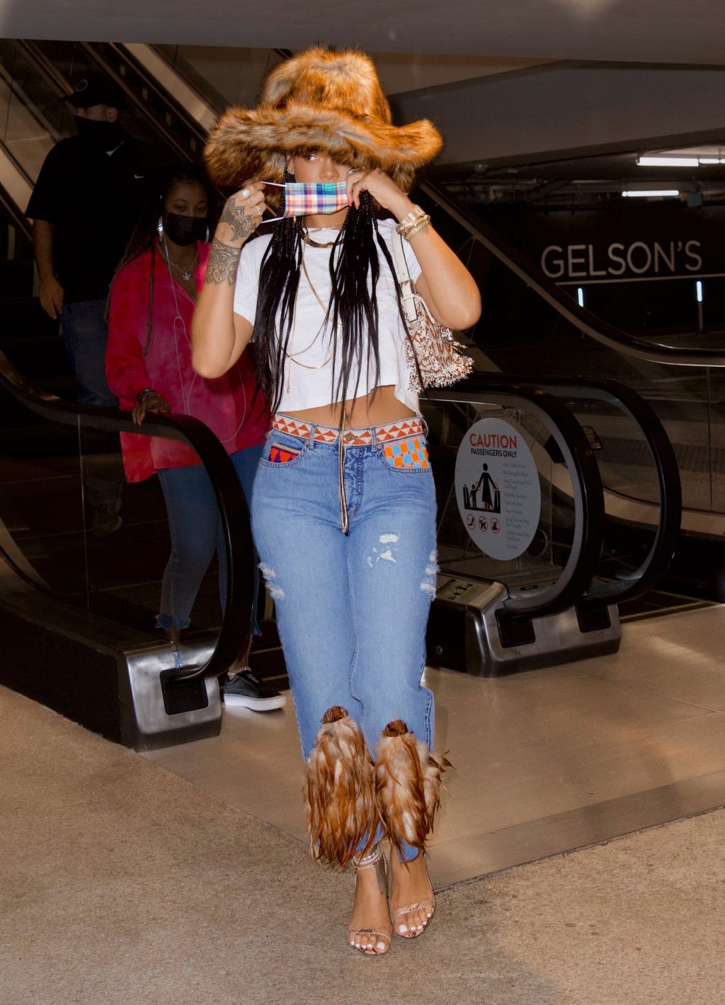 Rihanna Looks Flawless in a Fur Hat and Feathered Jeans (25 Photos)