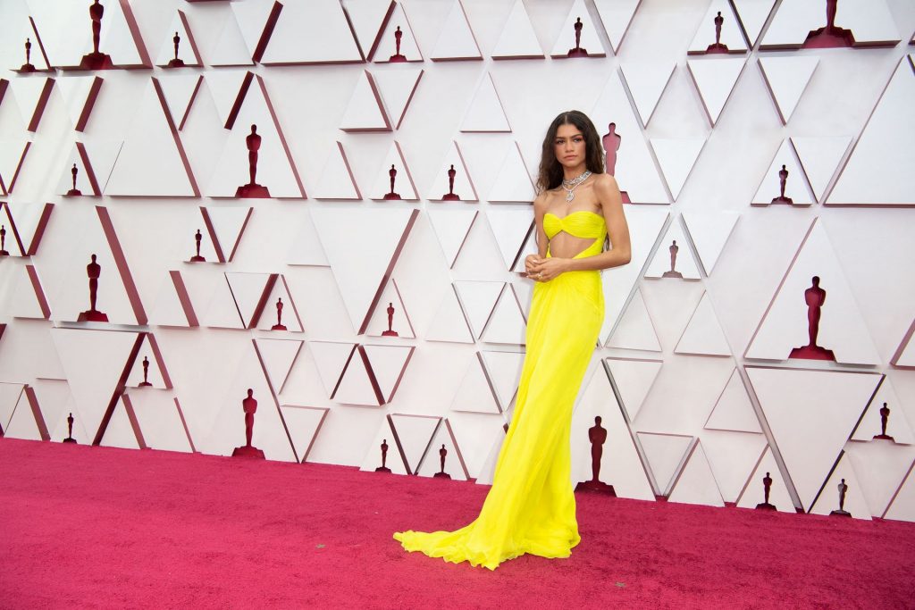 Zendaya Arrives at the Oscars Wearing a Mask and Long Yellow Gown (35 Photos)