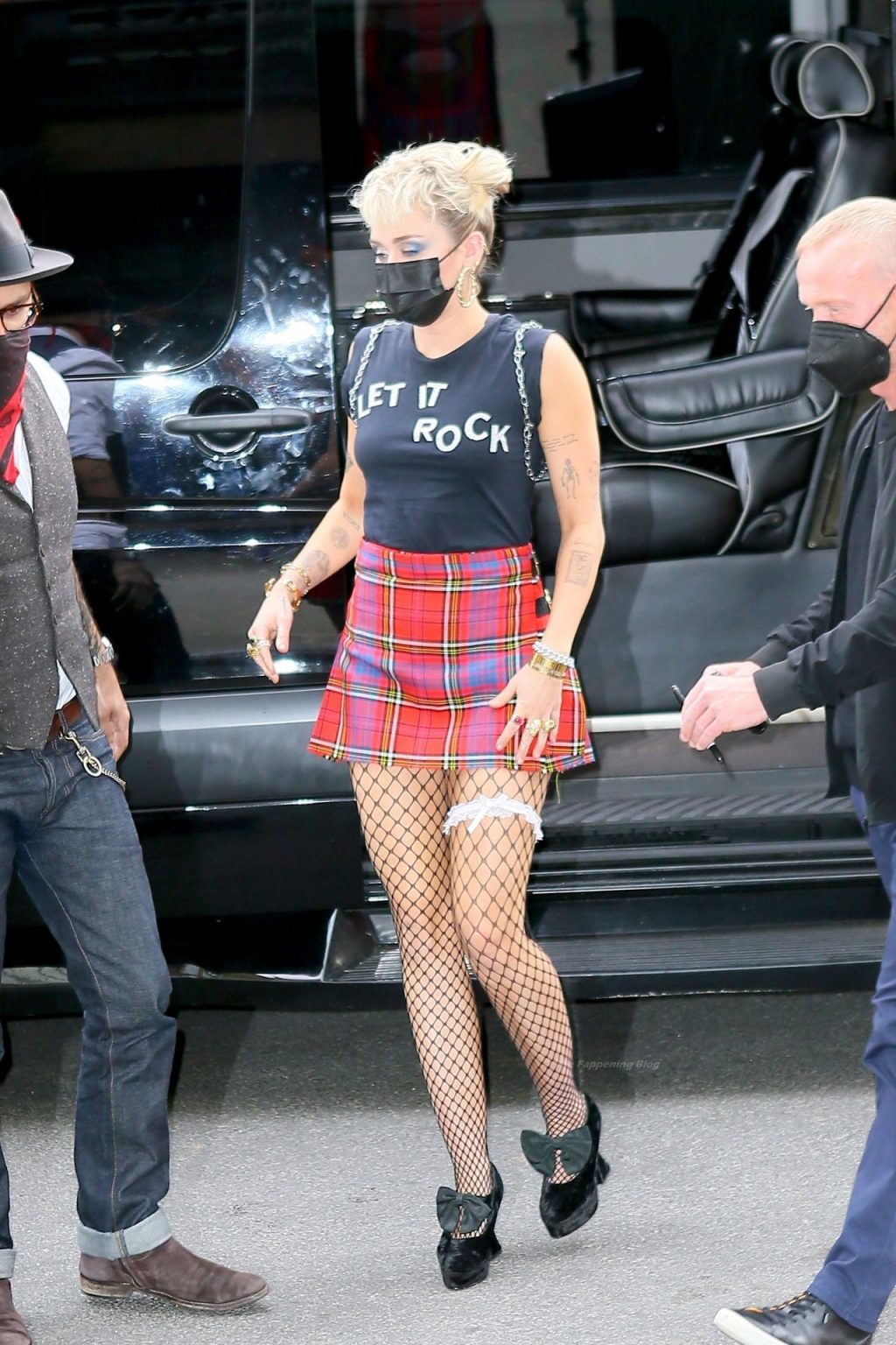 Miley Cyrus Grabs Attention in a Mini Skirt and Fishnets in NYC (22 Photos)