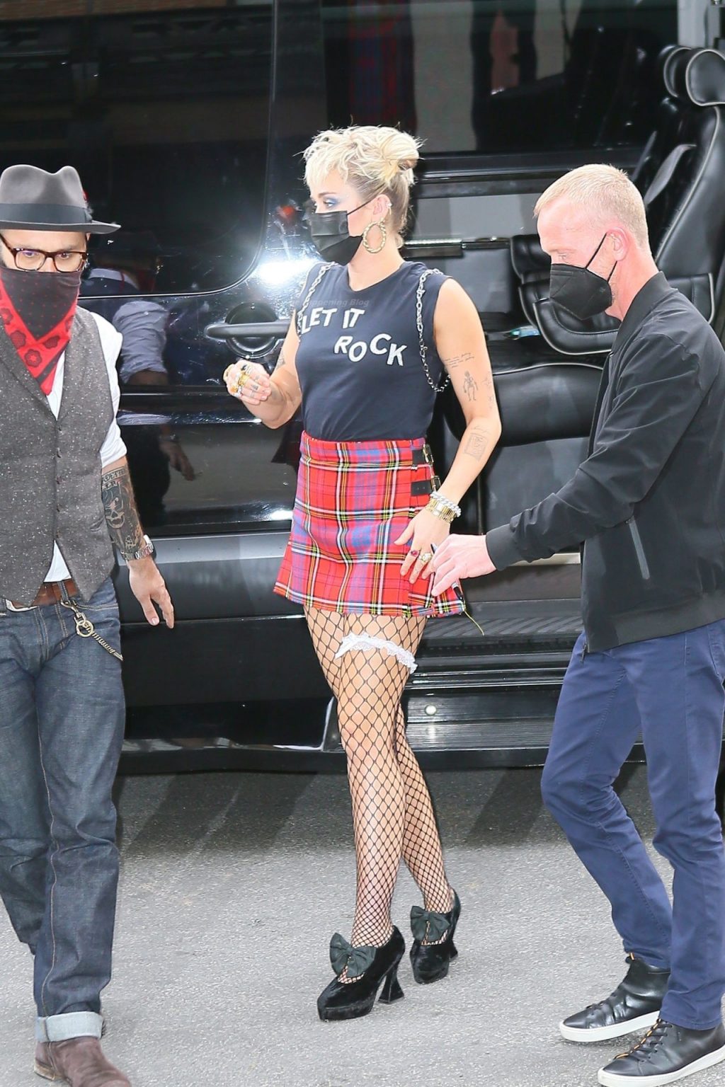 Miley Cyrus Grabs Attention in a Mini Skirt and Fishnets in NYC (22 Photos)