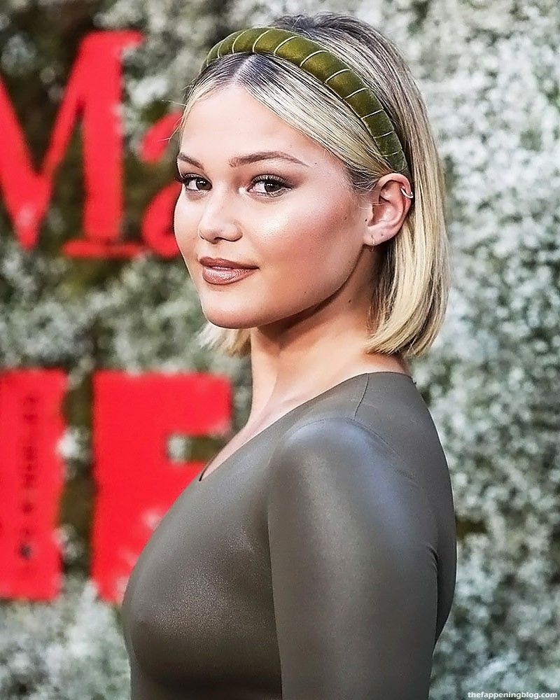 Olivia Holt braless on the red carpet.