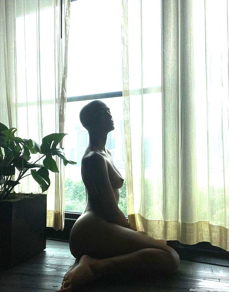American actress/model Indya Moore poses naked in front of the window in a ...