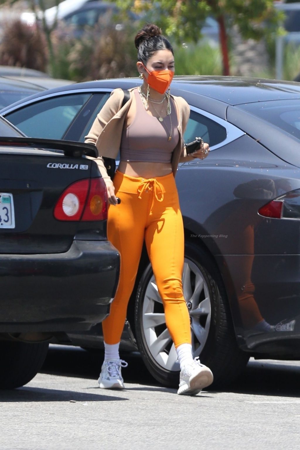 Vanessa Hudgens Turns Heads in Bright Orange Pants and Cropped Tank (17 Photos)