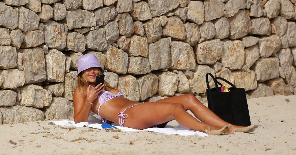 Arabella Chi is Seen in a Purple Bikini while Relaxing on the Beach in Spain (31 Photos)