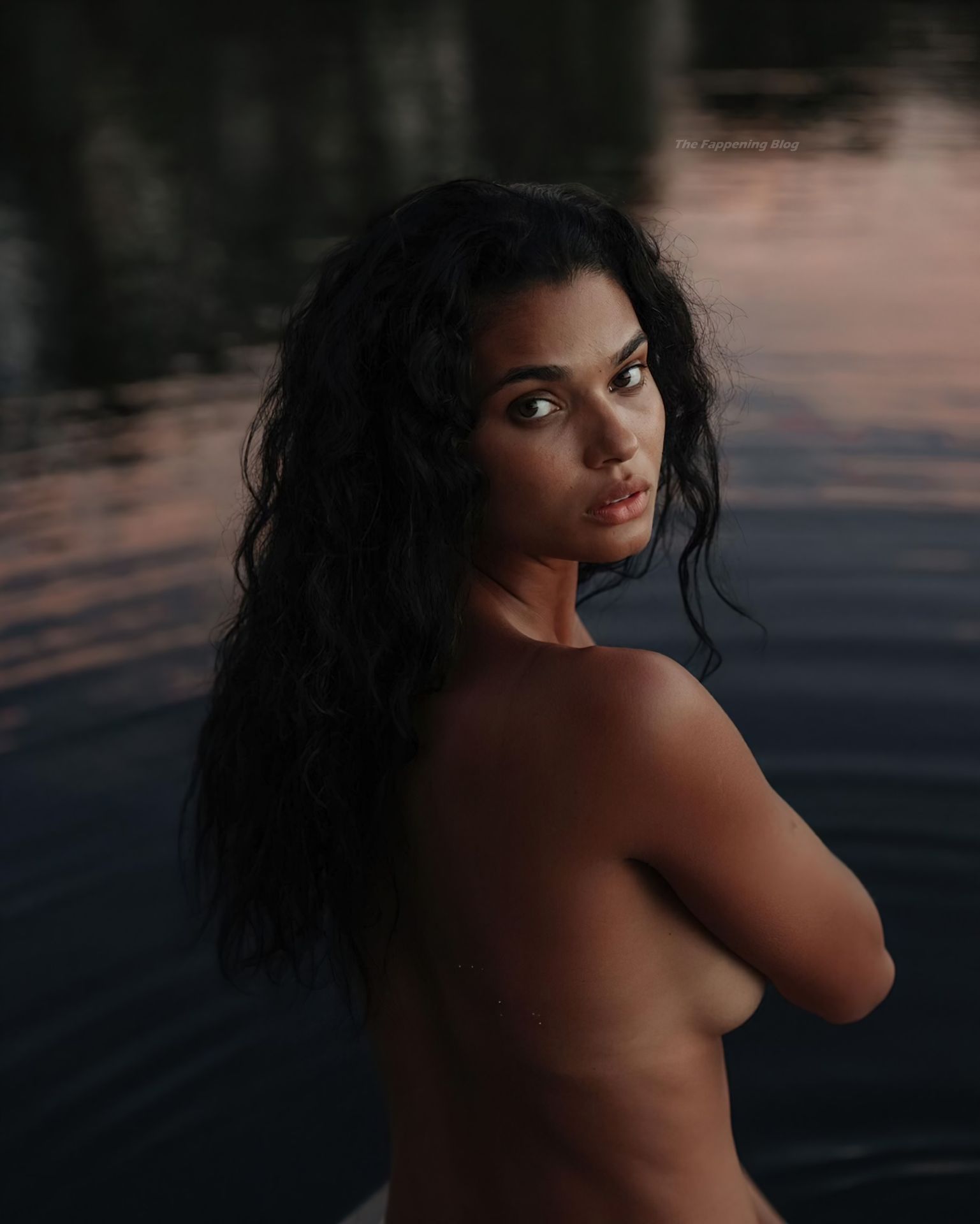 Model Daniela Braga shows off her tanned figure posing almost nude and in b...