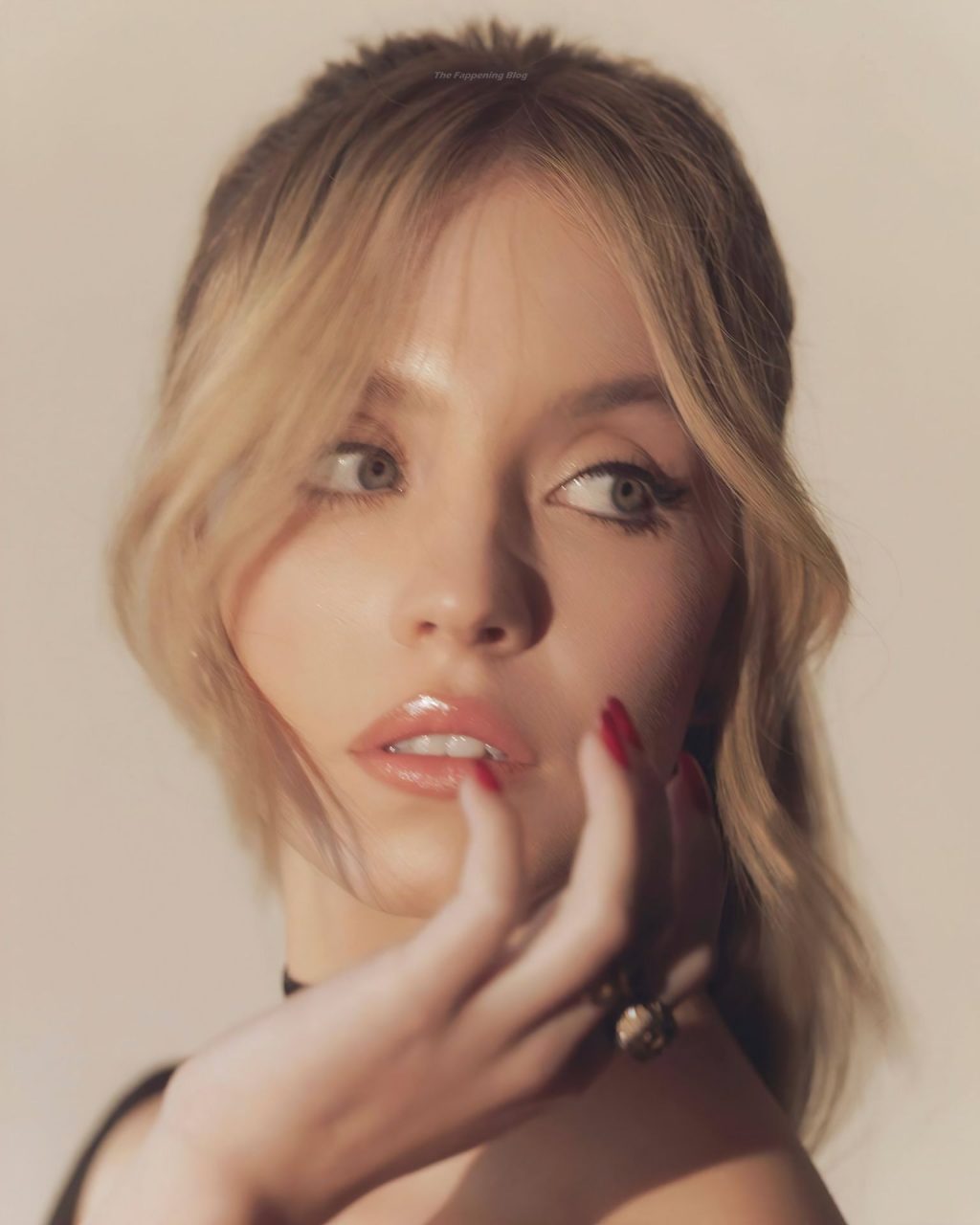 Sydney Sweeney Shows Off Her Ample Cleavage for ‘The Voyeurs’ (11 Photos)