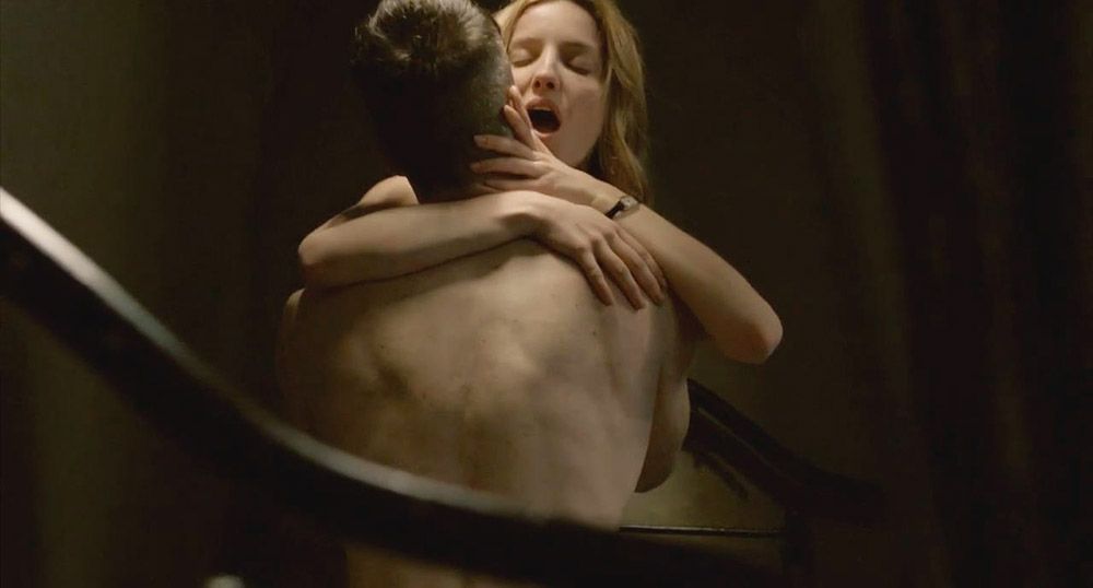 Blonde sexy Annabelle Wallis then is lying naked in bed underneath a guy as...