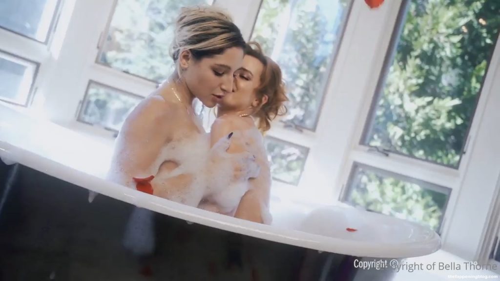 Two friends, Bella Thorne and Abella Danger, play in a bubble bath with ros...