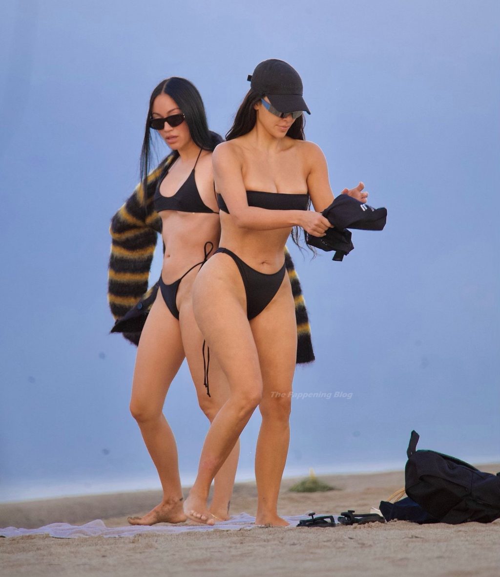 Kim Kardashian Flaunts Her Curves on The Beach (17 Photos)