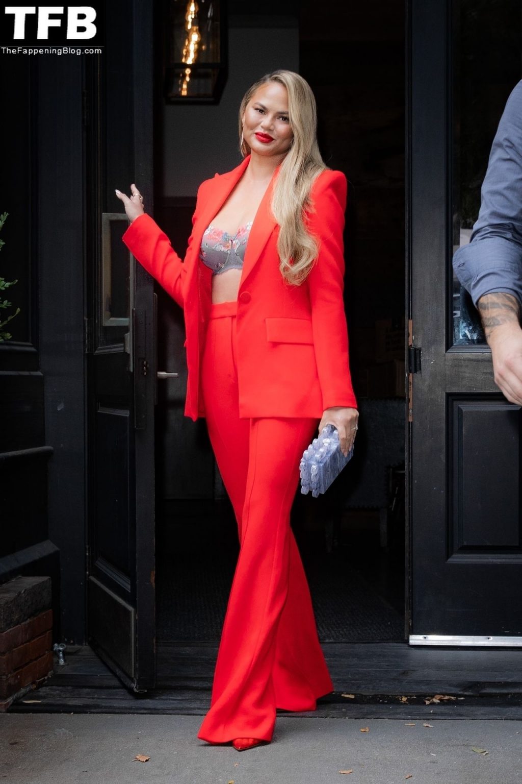 Chrissy Teigen Looks Hot in Red as she Heads to The Wendy Williams Show in NYC (10 Photos)