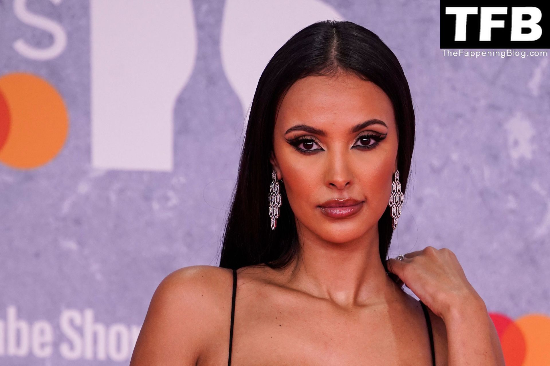 Maya Jama Flashes Her Boobs and Abs in a Very Skimpy Dress at The BRIT Awar...