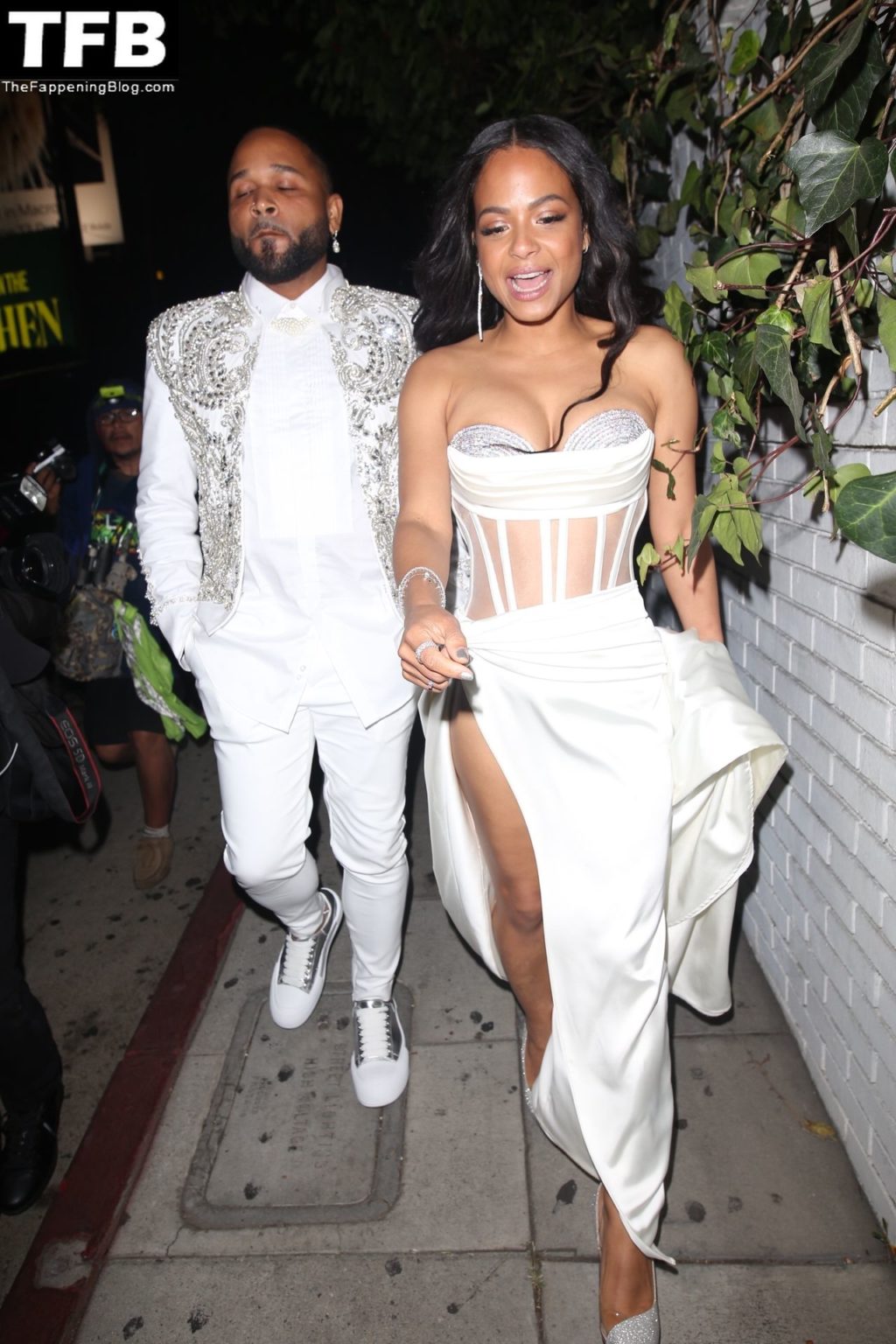 Christina Milian and a Friend Arrive at Jay-Z’s Oscar Afterparty (9 Photos)
