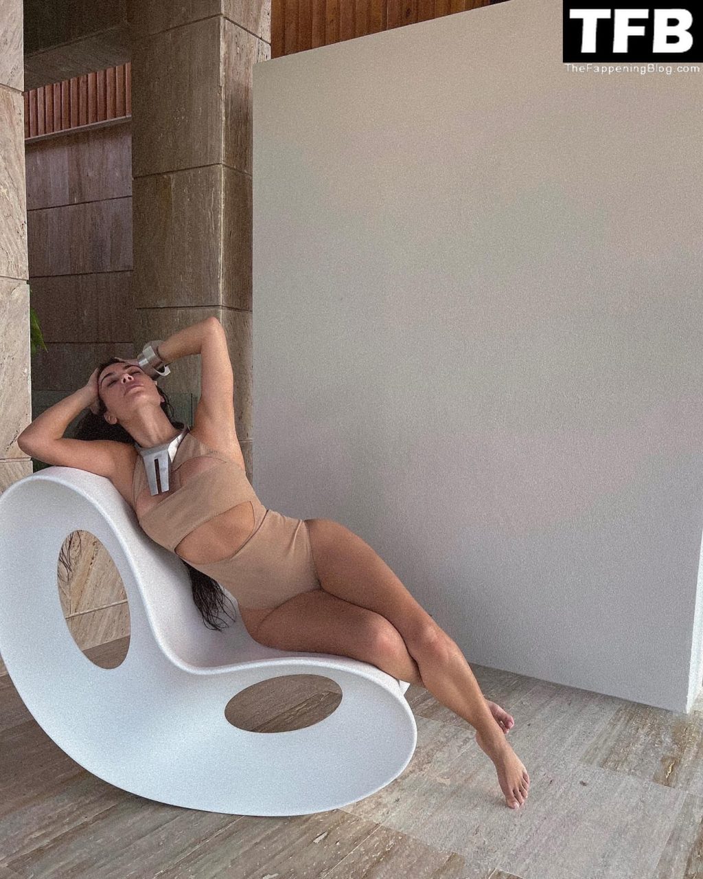Kim Kardashian Shows Off Her Curves in a Monokini (6 Photos)