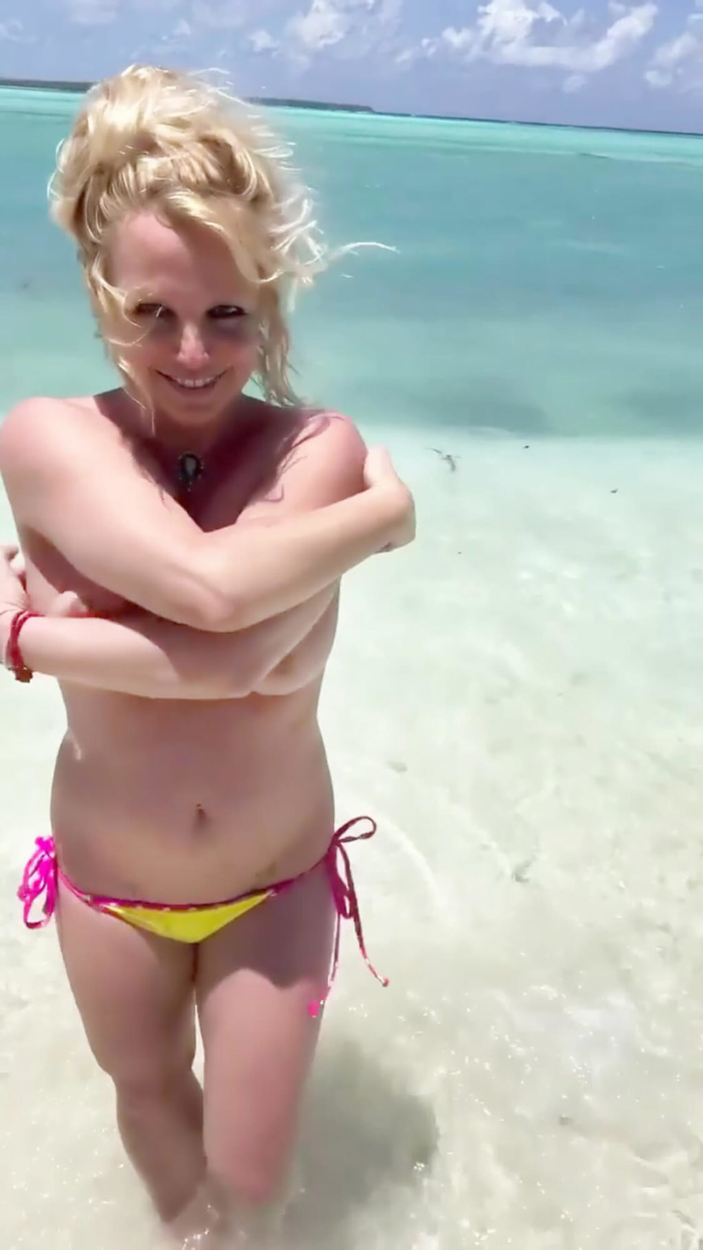 Britney Spears Flashes Her Nude Tits as She Poses Topless on The Beach (14 Enhanced Pics + Video)