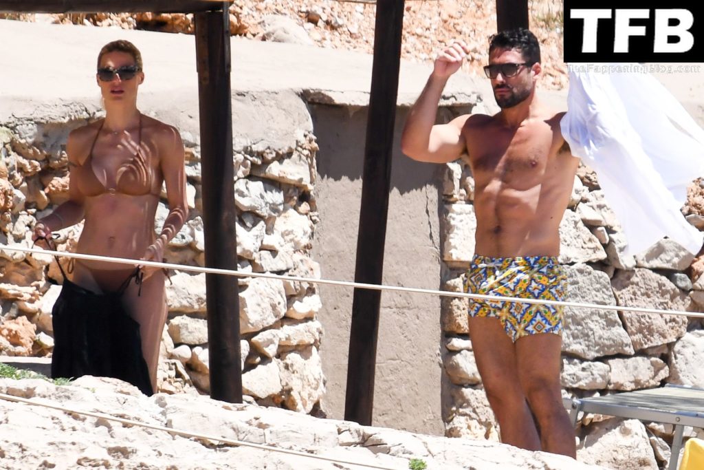 Michelle Hunziker &amp; Giovanni Angiolini Relax on the Beach of Their Hotel in Sardinia (16 Photos)