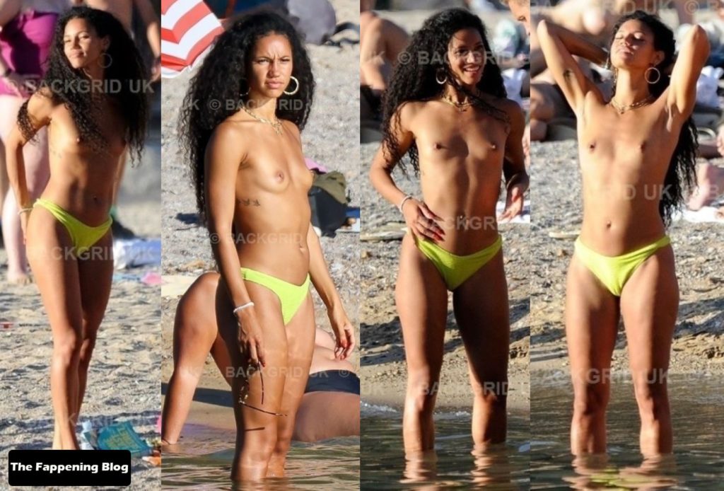 Vick Hope Displays Her Nude Breasts on the Beach in Ibiza (2 Photos)