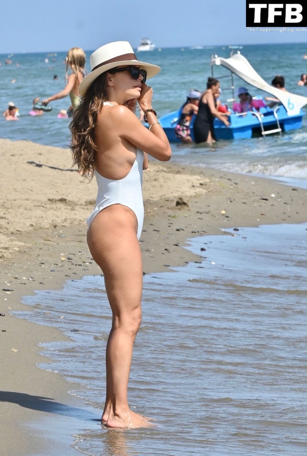 Eva Longoria Wows in a White Swimsuit on the Beach in Marbella (42 Photos)