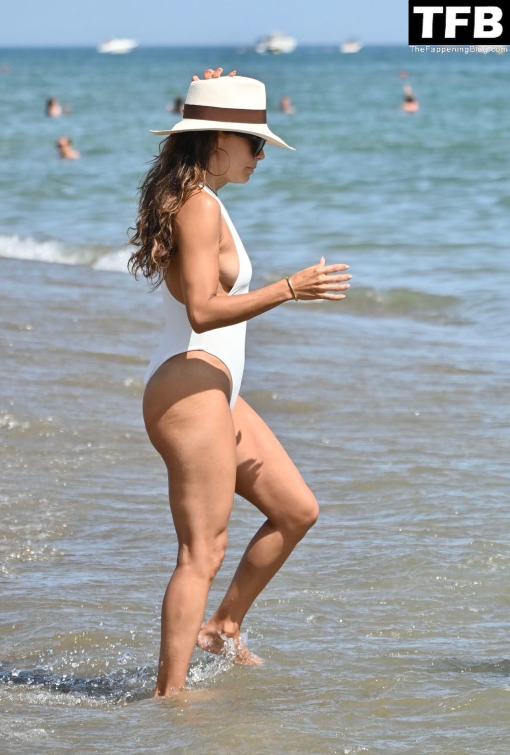 Eva Longoria Wows in a White Swimsuit on the Beach in Marbella (42 Photos)