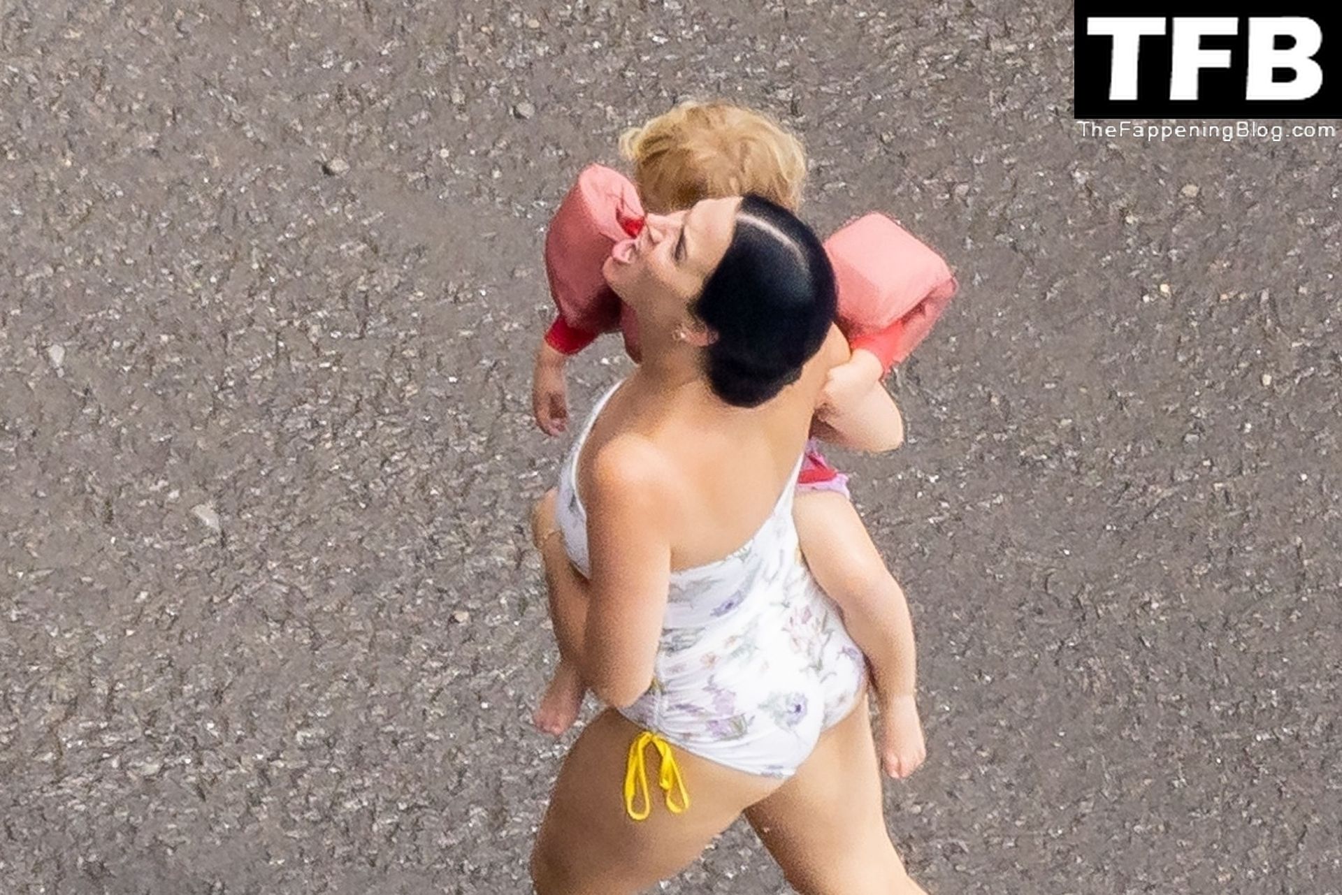 Katy Perry Rocks a Strapless Swimsuit While Enjoying a Beach Day with Orlan...