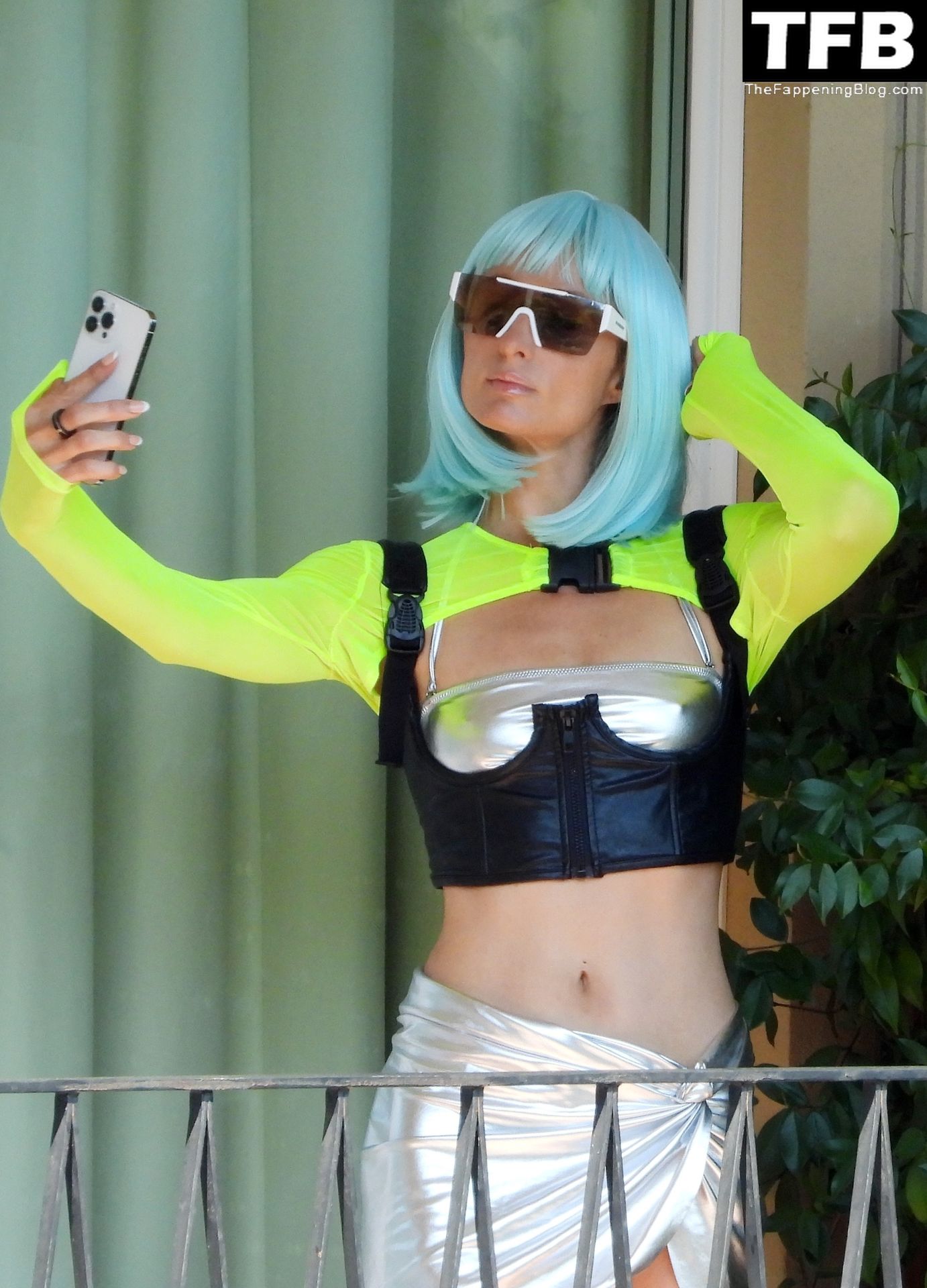 Paris Hilton Poses in a Silver Bikini on Hotel Room’s Balcony in Portofino (34 Photos)