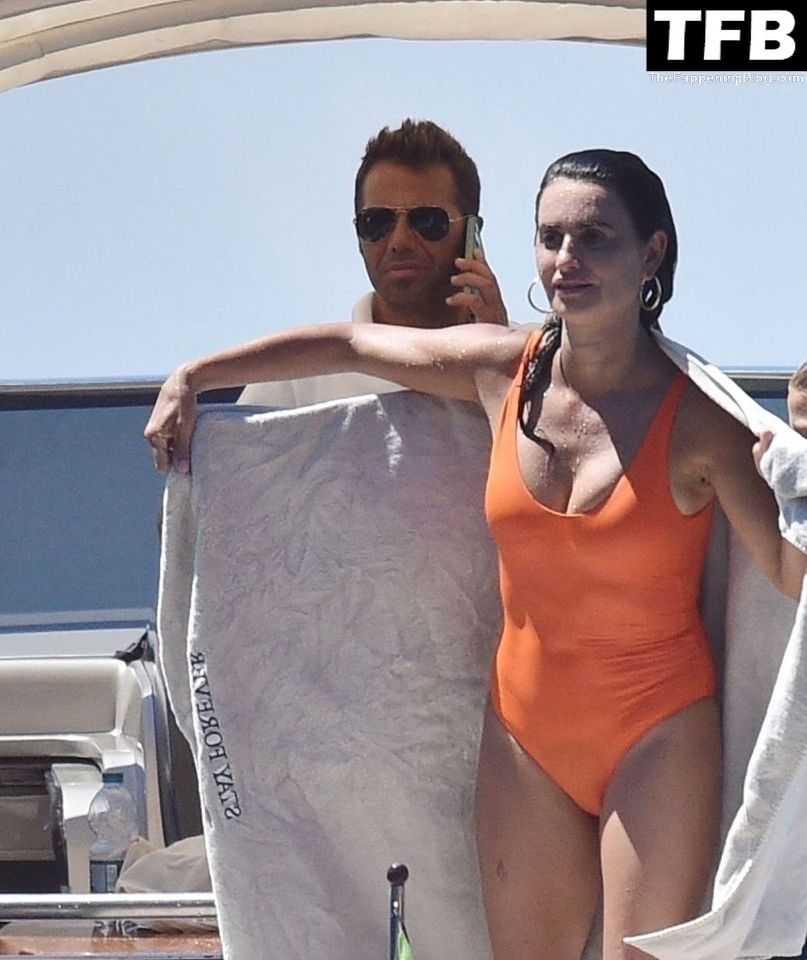 Spanish actress Penelope Cruz wearing a bright orange bikini enjoys a day a...