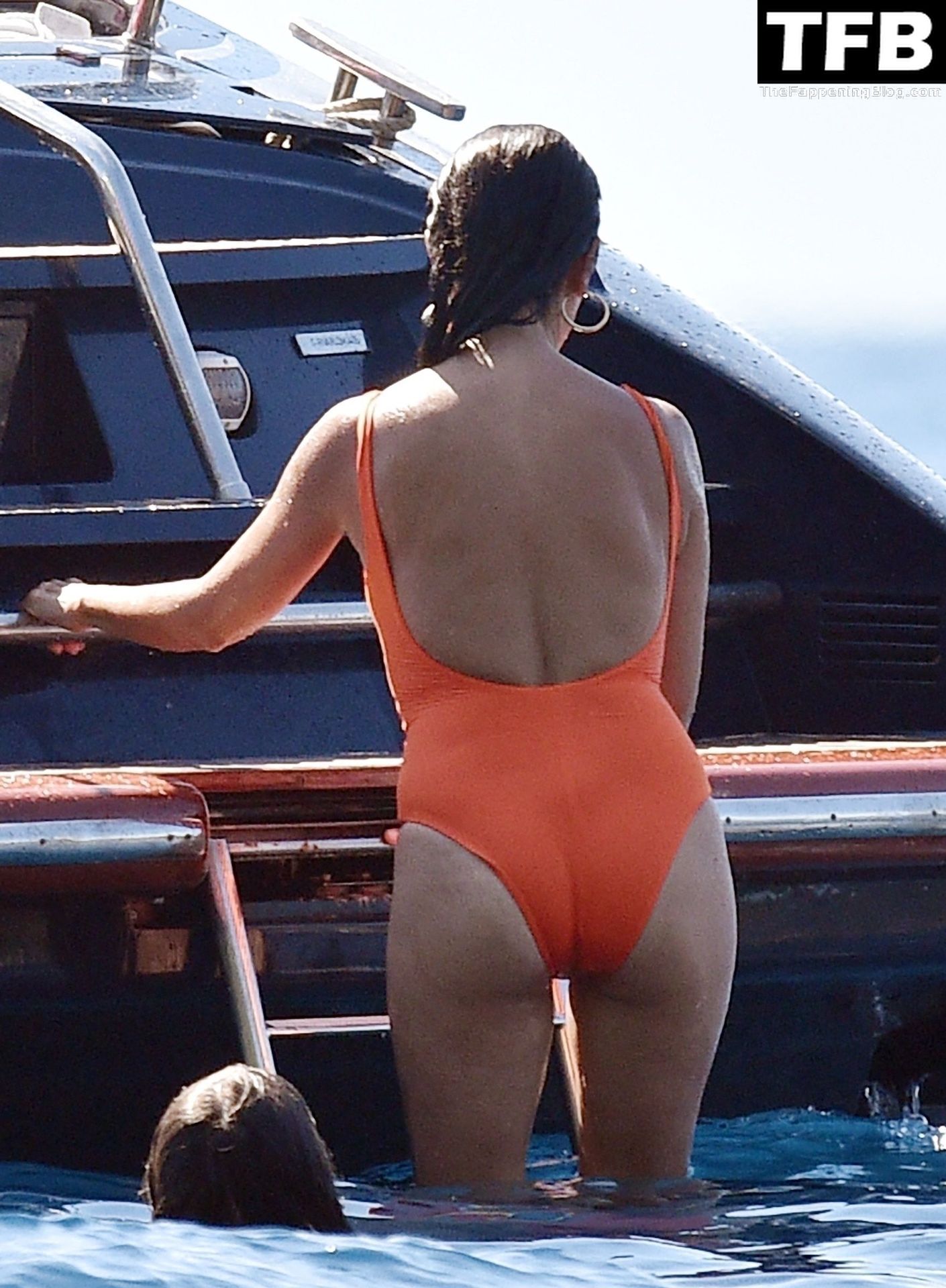 Spanish actress Penelope Cruz wearing a bright orange bikini enjoys a day a...