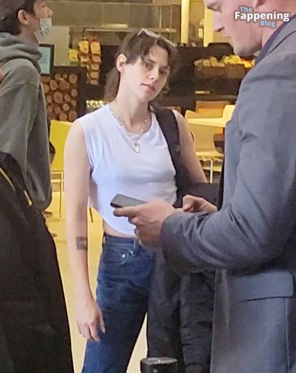 Kristen Stewart Shows Her Pokies at LAX with fiance Dylan Meyer (15 Photos)