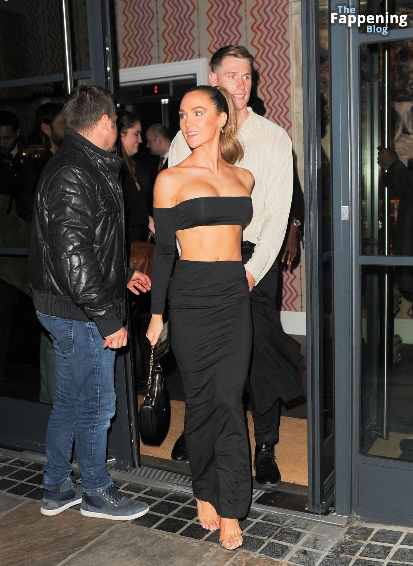 Jessie Wynter Flaunts Her Sexy Figure Leaving the “Ghosted” Premiere in London (8 Photos)