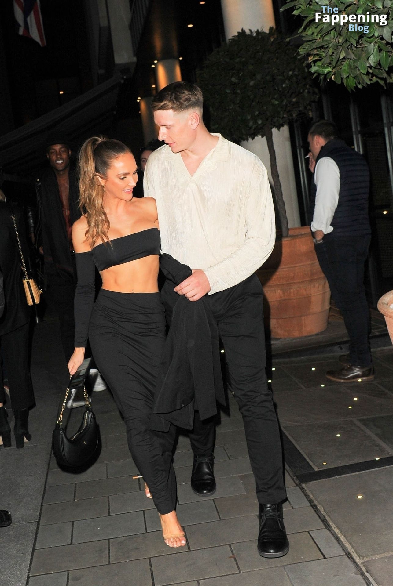 Jessie Wynter Flaunts Her Sexy Figure Leaving the “Ghosted” Premiere in London (8 Photos)