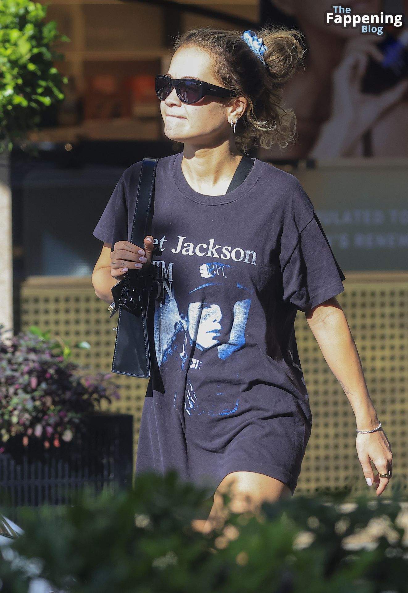 Rita Ora is Spotted Wearing a Vintage Janet Jackson ‘Rhythm Nation 1990’ Tour T-shirt on an Outing in Sydney (20 Photos