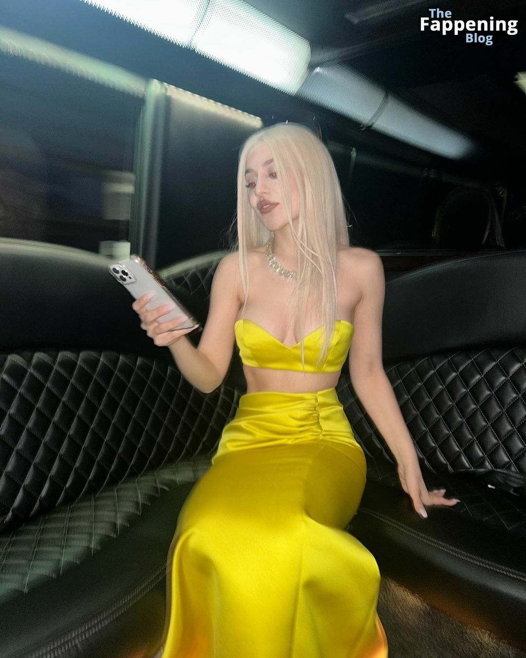 Ava-Max-Yellow-Outfit-Braless-Cleavage-2-thefappeningblog.com_.jpg