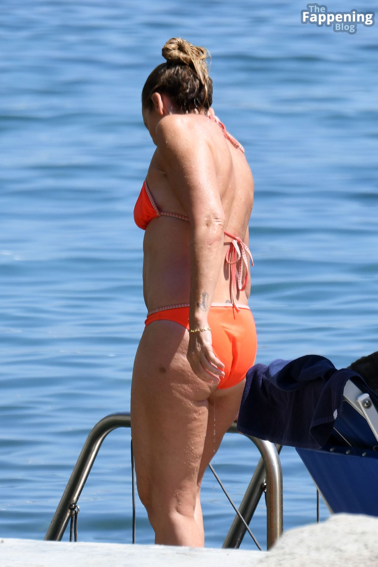 Toni Collette Wears An Orange Bikini As She S Spotted Sunbathing By The Sea In Ischia 16 Photos