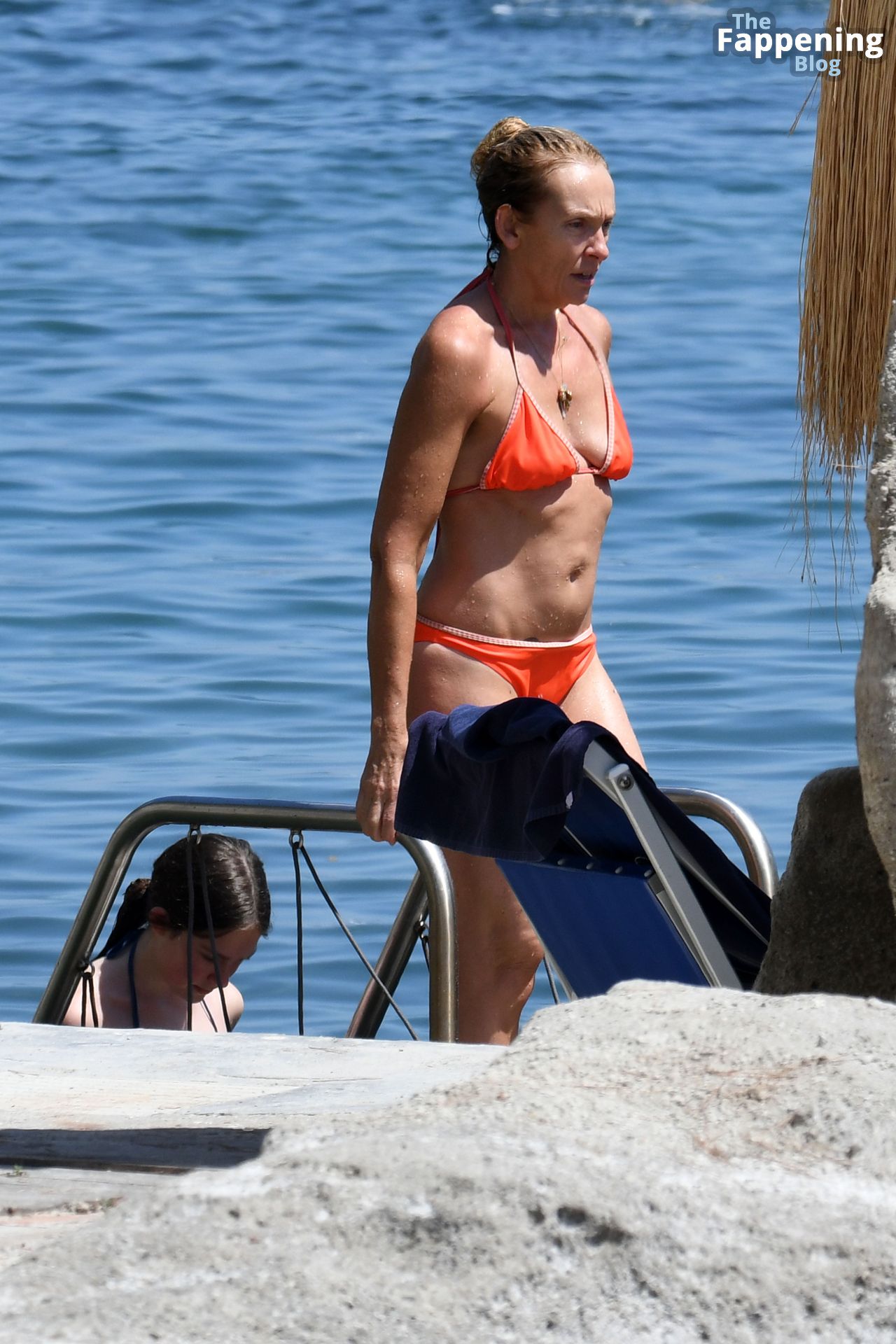 Toni Collette Wears an Orange Bikini as She’s Spotted Sunbathing by the Sea in Ischia (16 Photos)