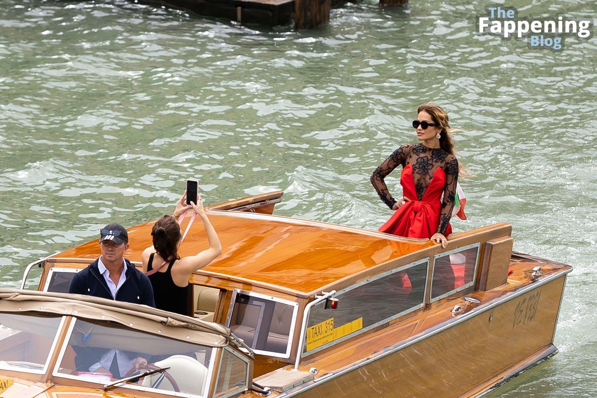 Rita Ora Flaunts Her Boobs and a Long Moschino Red Dress Heading to a Boat in Venice (42 Photos)