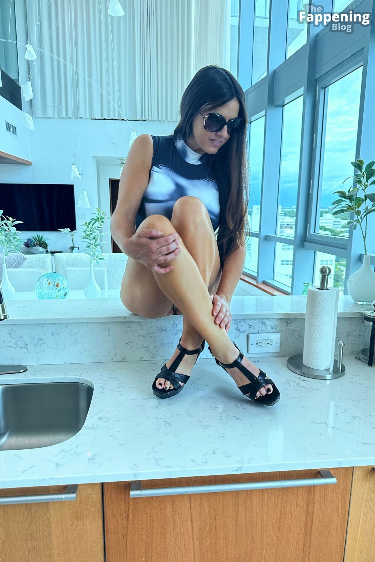 Claudia Romani Shows Off a New Bodysuit in Miami (Photos)