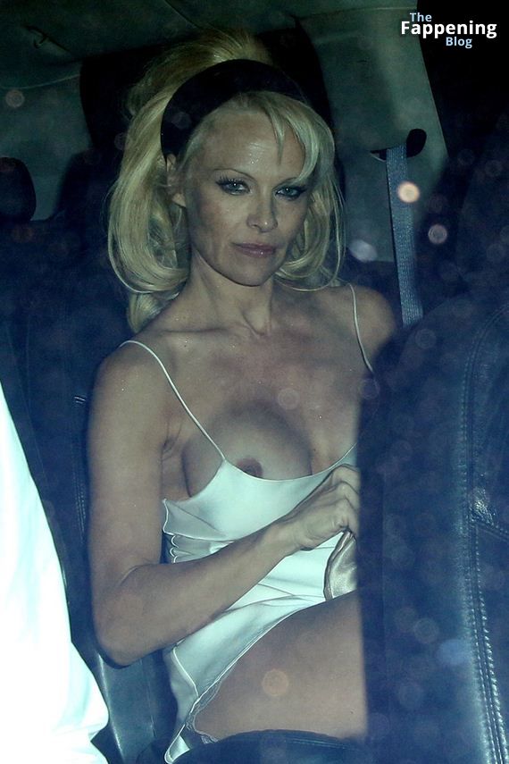 Pamela Anderson Flashes Her Nude Boob (18 Photos)