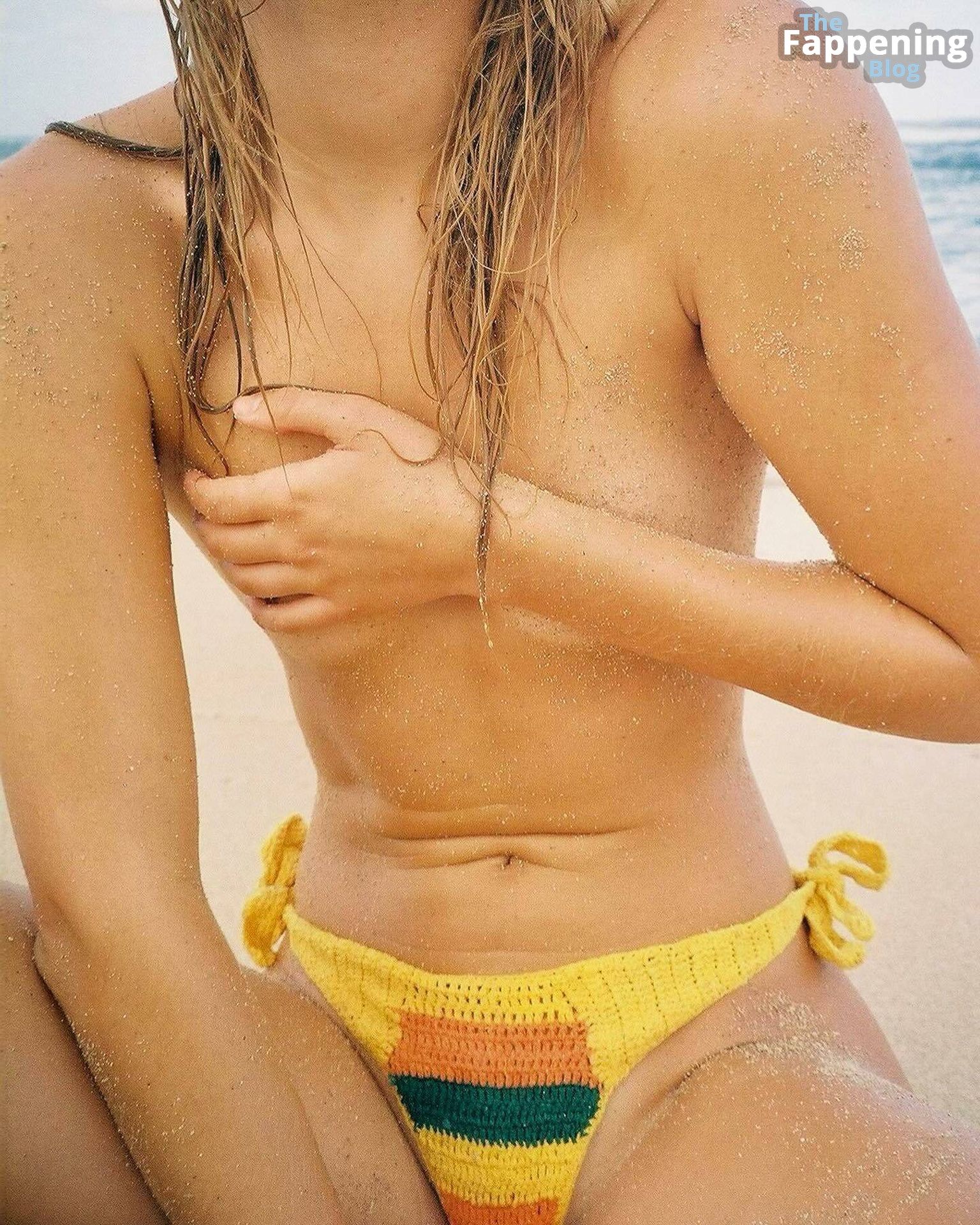 Olivia Ponton Poses Topless on the Beach (4 Photos)